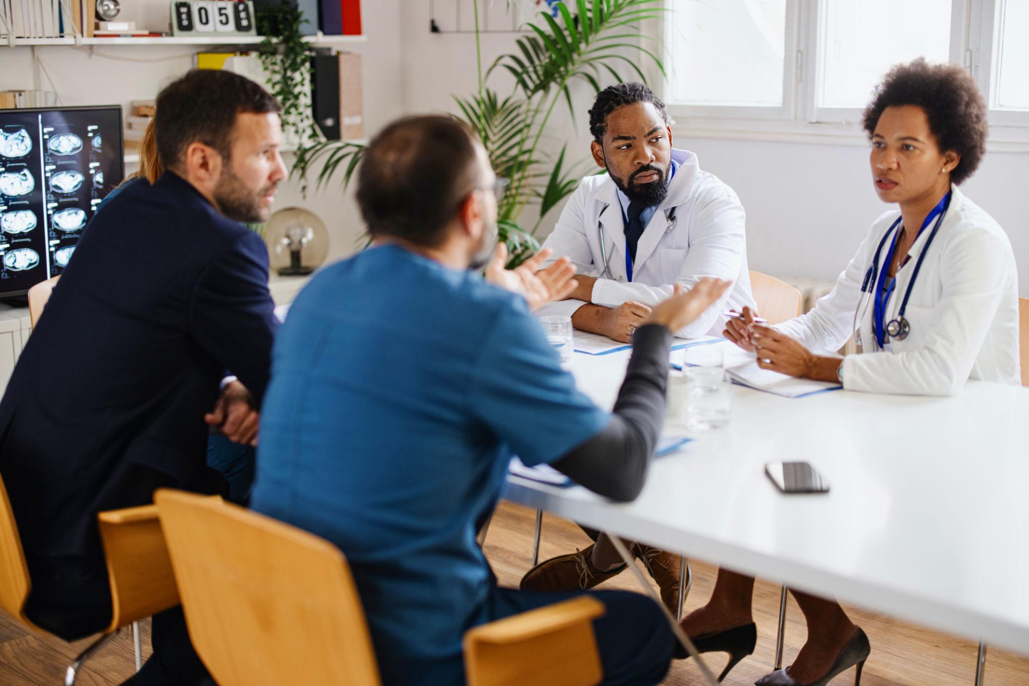 a visitor and a medical team for a meeting
