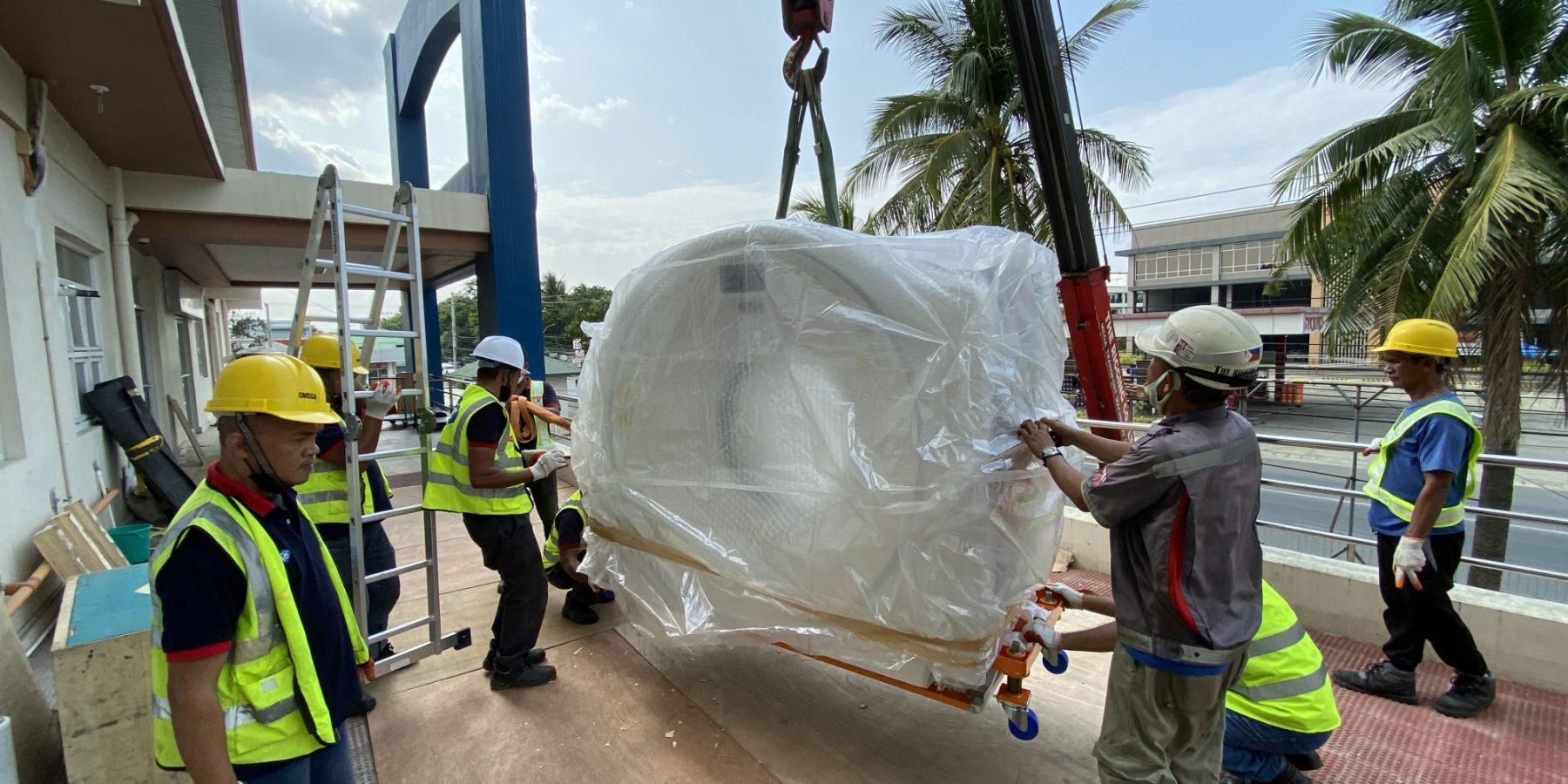 medical equipments being lifted by medical engineers